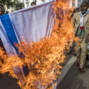 Illustrative: Moroccans burn the Israeli flag during a demonstration against the US Middle East peace plan in the capital Rabat on February 9, 2020. (FADEL SENNA / AFP)